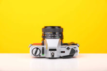 Load image into Gallery viewer, Minolta X-300 35mm Film Camera with Minolta MD 50mm f1.7 Lens in Red