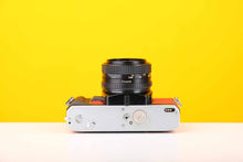 Load image into Gallery viewer, Minolta X-300 35mm Film Camera with Minolta MD 50mm f1.7 Lens in Red