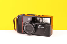 Load image into Gallery viewer, Nikon camera with yellow and black design on a two-tone yellow and white background