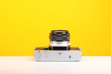 Load image into Gallery viewer, Olympus OM-1n SLR 35mm Film Camera with Olympus OM-System G.Zuiko Auto-W 28mm f3.5 Lens