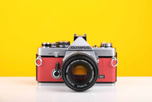 Load image into Gallery viewer, Olympus OM-2n MD 35mm SLR Film Camera with Zuiko Olympus OM-System Auto-S 50mm f1.8 Lens in Red