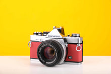 Load image into Gallery viewer, Olympus OM-2n MD 35mm SLR Film Camera with Zuiko Olympus OM-System Auto-S 50mm f1.8 Lens in Red