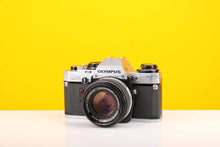 Load image into Gallery viewer, Olympus OM10 SLR 35mm Film Camera with Olympus Auto-S 50mm f/1.8 MC Lens