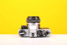 Load image into Gallery viewer, Olympus OM10 SLR 35mm Film Camera with Olympus Auto-S 50mm f1.8 MC Lens and Manual Adapter