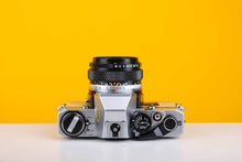 Load image into Gallery viewer, Olympus OM10 35mm SLR Film Camera with Olympus Zuiko OM-System Auto-S 50mm f1.8 Lens in Light Yellow