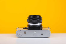 Load image into Gallery viewer, Olympus OM10 35mm SLR Film Camera with Olympus Zuiko OM-System Auto-S 50mm f1.8 Lens in Light Yellow