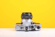 Load image into Gallery viewer, Olympus OM-1n 35mm SLR Film Camera with Olympus OM-System G.Zuiko Auto-S 50mm f1.4 Lens