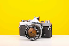 Load image into Gallery viewer, Olympus OM-1n 35mm SLR Film Camera with Olympus OM-System G.Zuiko Auto-S 50mm f1.4 Lens