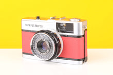 Load image into Gallery viewer, Olympus Trip 35 vintage film camera with customized red skin, displayed against a yellow background.
