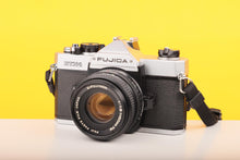 Load image into Gallery viewer, Fujica STX-1 35mm SLR Film Camera with 50mm X-Fujinon f1.9 Lens