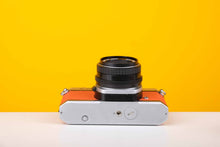 Load image into Gallery viewer, Pentax K1000 35mm Film Camera with SMC Pentax M 50mm f/2 Prime Lens in Orange