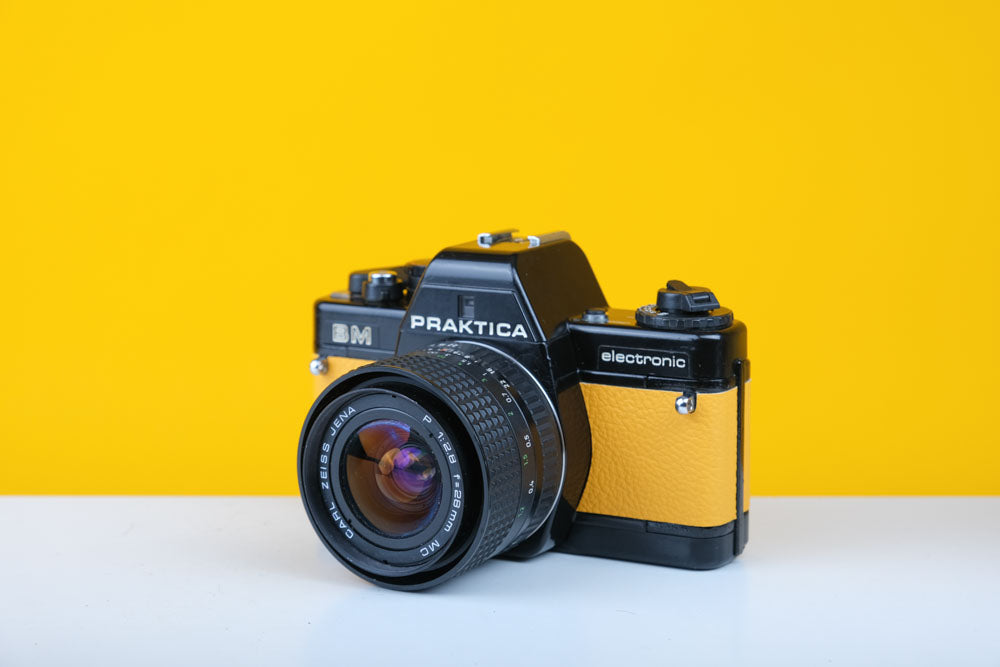 Praktica BM 35mm SLR Film Camera with New Yellow Leather Skin with Carl Zeiss 28mm f2.8 Prime Lens