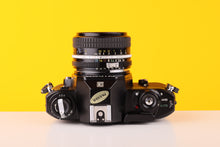 Load image into Gallery viewer, Nikon EM 35mm Film Camera with Nikon 50mm f/1.8 Lens
