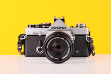 Load image into Gallery viewer, proof-195Olympus OM-2n Silver 35mm Film Camera with Zuiko 50mm f/1.8