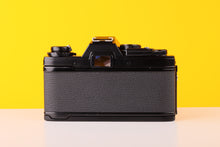 Load image into Gallery viewer, Olympus OM10 Black 35mm SLR Film Camera with Olympus OM-System Zuiko MC Auto-S 50mm f1.8 Lens and Manual Adapter