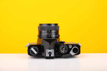 Load image into Gallery viewer, Topcon RE 200 35mm SLR Film Camera with RE Topcor 55mm f1.7 Lens in Grey