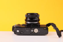 Load image into Gallery viewer, Minolta X-300 35mm SLR Film Camera with Soligor 28mm f/2.8 Lens