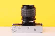 Load image into Gallery viewer, Olympus OM10 35mm Film SLR Camera + SunAction MC Auto Zoom 35–70mm f/3.5–4.5 Macro Lens