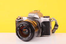 Load image into Gallery viewer, Nikon F65 35mm SLR Film Camera with Sigma 28–70mm f/3.5–4.5 Zoom Lens