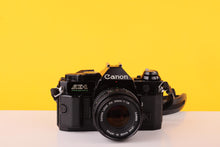 Load image into Gallery viewer, Canon AE-1 Program Black 35mm Film Camera with Canon FD 50mm f/1.8 Lens