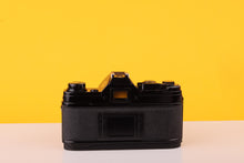 Load image into Gallery viewer, Canon AE-1 Black 35mm SLR Film Camera with Canon FD 35-70mm f/3.5-4.5 Zoom Lens