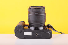 Load image into Gallery viewer, Canon EOS 10 35mm SLR Film Camera with Sigma UC Zoom 70–210mm f/4–5.6 Lens