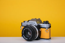 Load image into Gallery viewer, Olympus OM10 Vintage Film Camera with 50mm f/1.8 Lens With New Leather Yellow Skin
