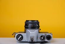 Load image into Gallery viewer, Pentax K1000 35mm Film Camera with SMC Pentax M 50mm f/1.7 Prime Lens and New Grey Leather Skin