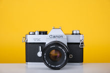 Load image into Gallery viewer, Canon TX 35mm SLR Film Camera with Canon FD 50mm f/1.8 Prime lens