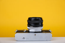 Load image into Gallery viewer, Canon TX 35mm SLR Film Camera with Canon FD 50mm f/1.8 Prime lens