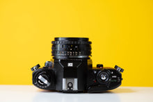 Load image into Gallery viewer, Nikon EM 35mm Film Camera with Nikon 50mm f/1.8 Lens