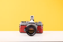 Load image into Gallery viewer, Olympus OM-1 35mm SLR Film Camera with Olympus OM-System G.Zuiko Auto-S 50mm f1.4 Lens in Red

