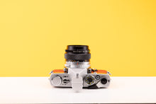 Load image into Gallery viewer, Olympus OM-1 35mm SLR Film Camera with Olympus OM-System G.Zuiko Auto-S 50mm f1.4 Lens in Red
