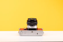 Load image into Gallery viewer, Olympus OM-1 35mm SLR Film Camera with Olympus OM-System G.Zuiko Auto-S 50mm f1.4 Lens in Red
