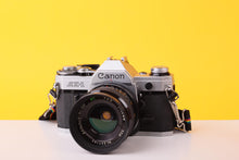 Load image into Gallery viewer, Canon AE-1 35mm Film SLR Camera with Kenlock  MC 28mm f/2.8 Lens
