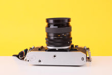 Load image into Gallery viewer, Canon AE-1 35mm Film SLR Camera with Kenlock  MC 28mm f/2.8 Lens
