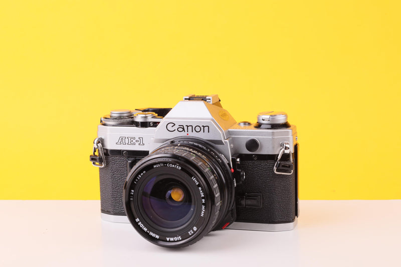 Canon AE-1 35mm Film SLR Camera with Sigma Mini-Wide II 28mm f/2.8 Lens
