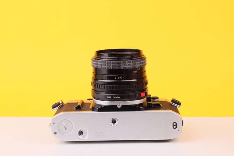 Canon AE-1 35mm Film SLR Camera with Sigma Mini-Wide II 28mm f/2.8 Lens