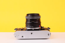 Load image into Gallery viewer, Canon AE-1 35mm Film SLR Camera with Sigma Mini-Wide II 28mm f/2.8 Lens
