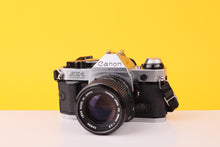 Load image into Gallery viewer, Canon AE-1 Program 35mm Film SLR Camera with Canon FD 100mm f/2.8 Lens
