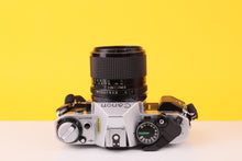 Load image into Gallery viewer, Canon AE-1 Program 35mm Film SLR Camera with Canon FD 100mm f/2.8 Lens
