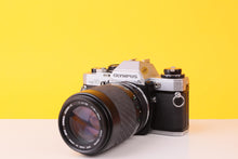 Load image into Gallery viewer, Olympus OM10 35mm Film SLR Camera with Sigma 70–210mm f/4–5.6 Telephoto Zoom Lens
