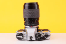 Load image into Gallery viewer, Olympus OM10 35mm Film SLR Camera with Sigma 70–210mm f/4–5.6 Telephoto Zoom Lens
