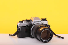 Load image into Gallery viewer, Olympus OM10 35mm Film SLR Camera with Olympus E.Zuiko Auto-T 135mm f/3.5 Lens
