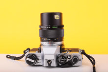 Load image into Gallery viewer, Olympus OM10 35mm Film SLR Camera with Olympus E.Zuiko Auto-T 135mm f/3.5 Lens

