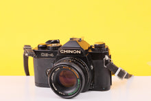 Load image into Gallery viewer, Chinon CE-4 35mm Film SLR Camera with Auto Chinon 50mm f/1.7 Lens
