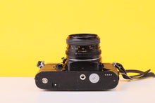 Load image into Gallery viewer, Chinon CE-4 35mm Film SLR Camera with Auto Chinon 50mm f/1.7 Lens
