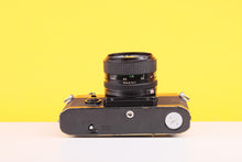 Load image into Gallery viewer, Canon F-1 35mm Film SLR Camera with Canon FD 50mm f/1.4 Lens
