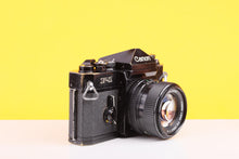 Load image into Gallery viewer, Canon F-1 35mm Film SLR Camera with Canon FD 50mm f/1.4 Lens
