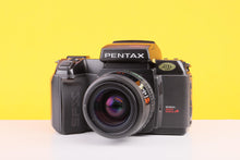 Load image into Gallery viewer, Pentax SFX 35mm Film SLR Camera with Pentax-F 35–70mm Zoom Lens
